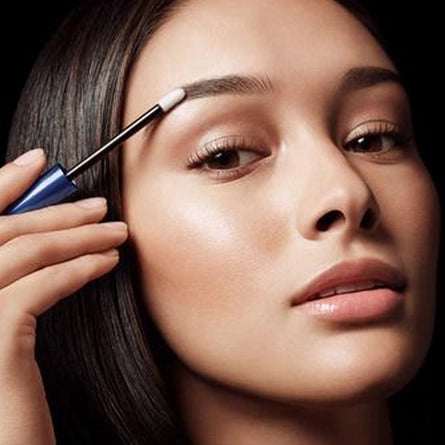 Female Applying Revitalash Cosmetics Revitabrow To Her Eyebrow
